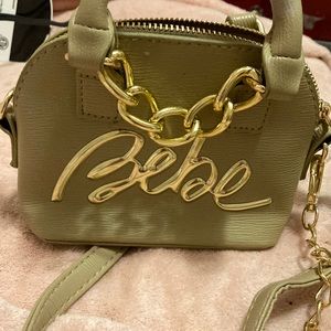 Tan Bebe purse small for when you don’t have much to carry.